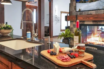 Island seating for 10 means the cook’s never left out of the conversation—grazing boards, wine, and late‑night snacks all live here.