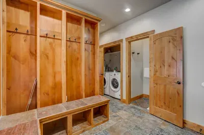 From snow boots to base layers, this hardworking mudroom and laundry room—with dedicated ski lockers and ample cabinetry—makes coming home from the slopes effortlessly tidy