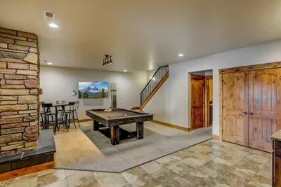 Head downstairs for pool, the theater room, and three bedrooms. Two living spaces means no one compromises on their kind of fun.