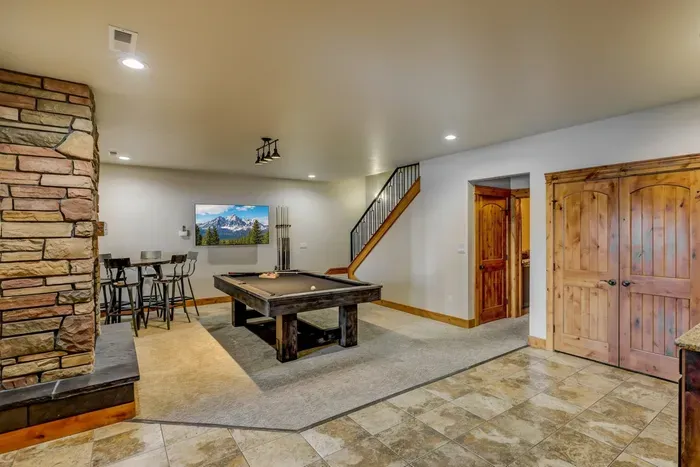 Head downstairs for pool, the theater room, and three bedrooms. Two living spaces means no one compromises on their kind of fun.