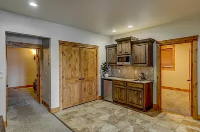 Pool table, bar, and fireplace—call it the adult playground