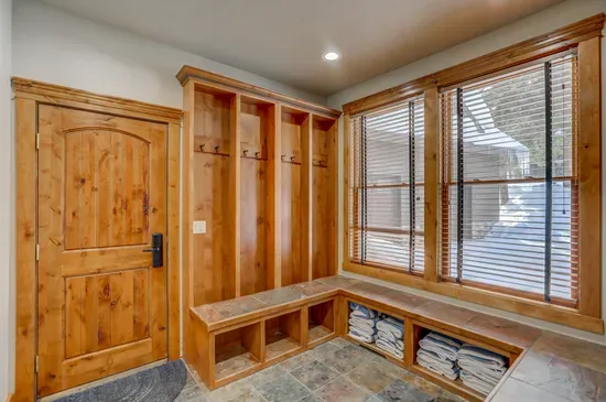 Gear up, wash up, and stow it all away—this mudroom + laundry combo features custom ski lockers and wall-to-wall storage to keep every adventure organized.