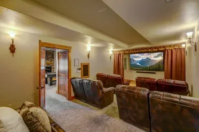 The theater room is movie night done right--includes a smart TV, cable, and DVD player