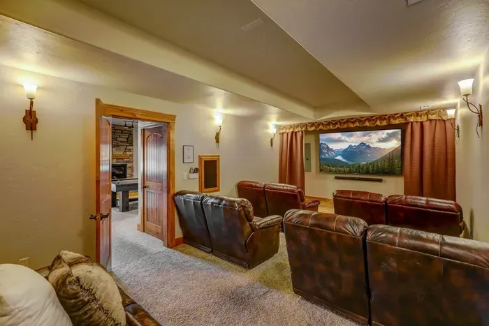 The theater room is movie night done right--includes a smart TV, cable, and DVD player