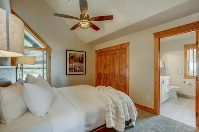 Soft bedding, warm light, and tree views—these upper king suites feel like a quiet mountain hotel inside your own house