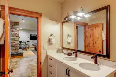 Daylight basement bathroom, with double-vanity and walk-in shower