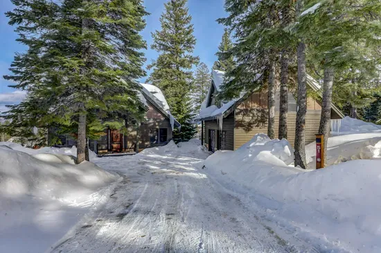 Close to lifts and golf, tucked into your own quiet pocket of trees (one garage space is unavailable, ATV is stored there)