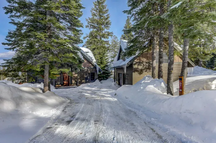 Close to lifts and golf, tucked into your own quiet pocket of trees (one garage space is unavailable, ATV is stored there)