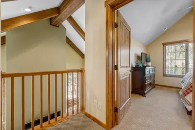 Escape to the second-floor primary bedroom, where privacy meets comfort with a cozy king bed just waiting for you