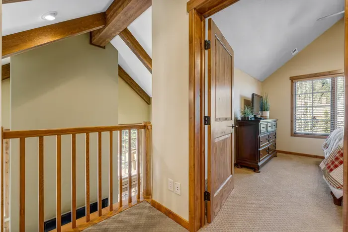Escape to the second-floor primary bedroom, where privacy meets comfort with a cozy king bed just waiting for you