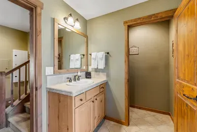 The main floor full bath features a walk-in shower, making it easy to freshen up after a day of adventure