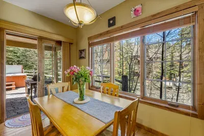 Enjoy seamless flow between the cozy indoor space and the covered back patio, where you can dine al fresco or inside
