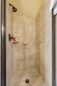 This bathroom also features a spacious walk-in shower