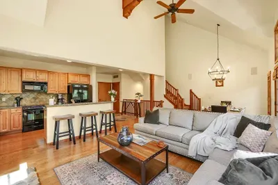 Enjoy the seamless flow between the fully-equipped kitchen and dining area, where the spacious table comfortably seats six for memorable meals with family and friends
