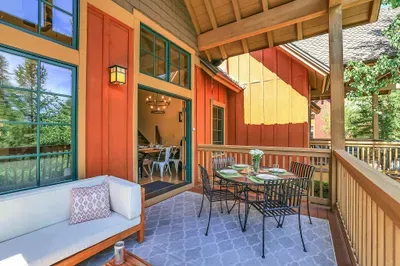 Alfresco Delight: The upper balcony invites you to dine under the stars or simply unwind with a book, enhancing the indoor-outdoor living experience at Alpine Escape