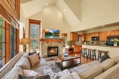 Enjoy the cozy warmth of the wood fireplace and unwind in the private hot tub after a day of adventure on the slopes