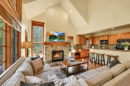 Enjoy the cozy warmth of the wood fireplace and unwind in the private hot tub after a day of adventure on the slopes
