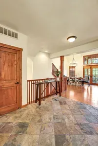 There are two guest bedrooms in the daylight basement, both providing access to the private hot tub and lower patio. There's also a spacious laundry room with washer/dryer