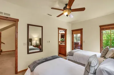Versatile Comfort: The twin guest bedroom offers a flexible sleeping arrangement, perfect for kids or friends, ensuring everyone enjoys a restful night's sleep. Enjoy access to the private hot tub and patio