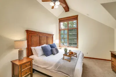Ultimate Retreat: The primary suite offers a serene escape, featuring a plush king bed that promises restful nights and rejuvenating mornings amidst peaceful surroundings