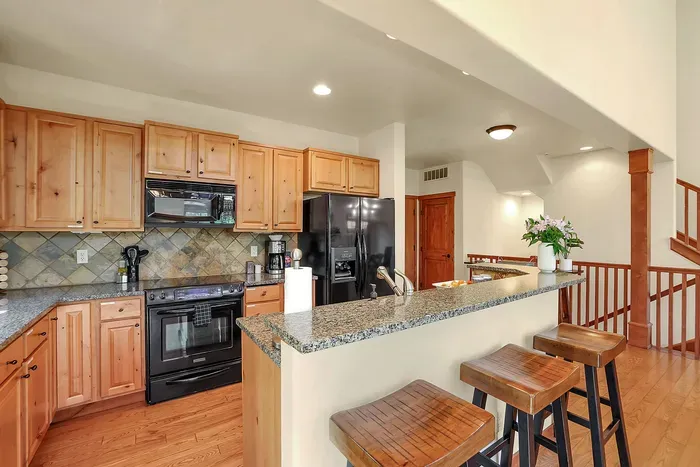 The open layout ensures everyone stays connected, whether you're cooking, dining, or lounging by the fire, making it ideal for gatherings and quality time