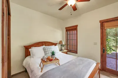 Cozy Retreat: The queen guest bedroom offers a comfortable and inviting space, perfect for unwinding after a day of exploration, complete with a plush bed that ensures restful sleep