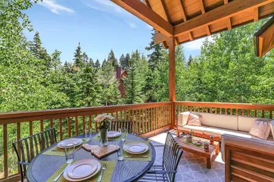 Step onto the balcony from the main living area and immerse yourself in the tranquil beauty of the surrounding forest, perfect for morning coffee or evening relaxation