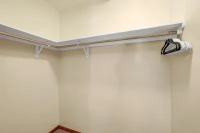 Experience the luxury of a large walk-in closet, offering ample space to keep your belongings organized and your living area clutter-free. With thoughtful design and plenty of storage options, it's perfect for extended stays