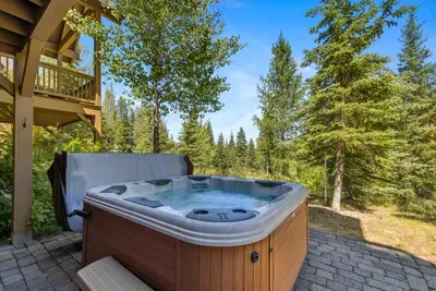Relax in your private hot tub after an exciting day on the mountain, all while enjoying peaceful forest views