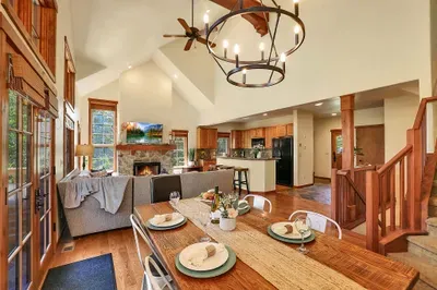 The open layout ensures everyone stays connected, whether you're cooking, dining, or lounging by the fire, making it ideal for gatherings and quality time