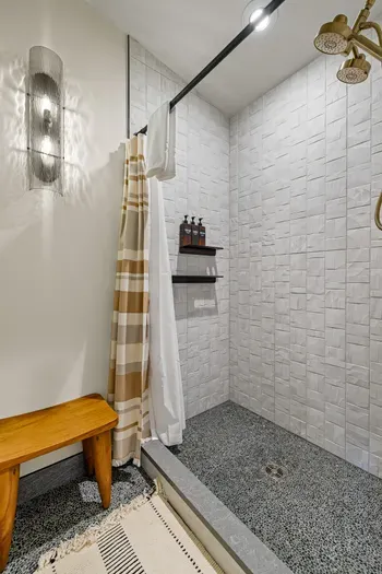 Morning rush? No problem—this bathroom was built for groups. Additional mirrored shower just across the bathroom