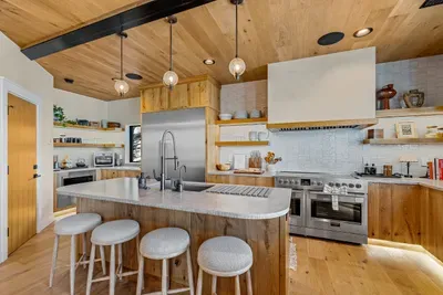 Fulgor Milano range and oversized Thermador fridge—cook once, feed everyone.