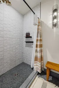 The second of two walk-in showers in the upstairs guest bathroom