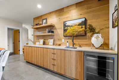 The wet bar is thoughtfully equipped with plasticware, perfect for enjoying beverages safely around the hot tub and patio areas
