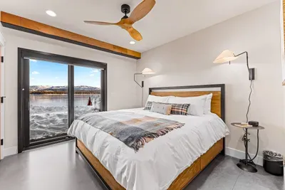 King bedroom on the lake level—roll out of bed and walk straight to the water.
