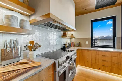 Fulgor Milano range and oversized Thermador fridge—cook once, feed everyone.
