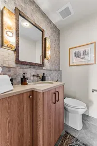Smart layout that keeps everyone moving and no one waiting. Downstairs powder room