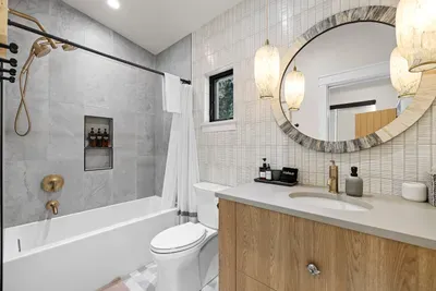 Plenty of hooks, counter space, and fluffy towels in every bathroom.