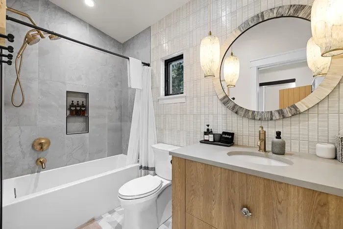 Plenty of hooks, counter space, and fluffy towels in every bathroom.