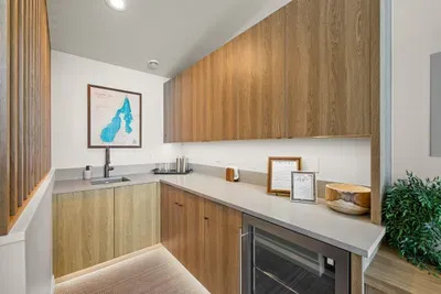 Wet bar within arm’s reach of the games—no one misses a turn.