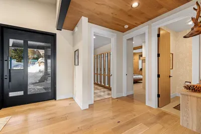 Lakefront Luxe has a super functional layout. On the main floor you'll find the primary bedroom, a powder room, and the incredibly unique mudroom and laundry room