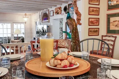 Vintage signs, collected art, and little details that feel more “home” than “rental.”