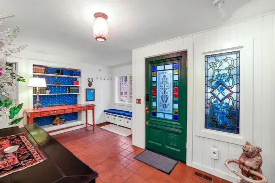 Step inside: original woodwork, vintage charm, and that “old family cabin” feeling