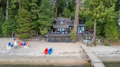 This is what “home for the week” looks like—deck, hot tub, and water just beyond.