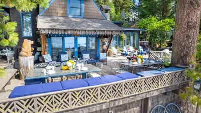 Two big granite dining tables on the deck mean everyone gets a seat with a view