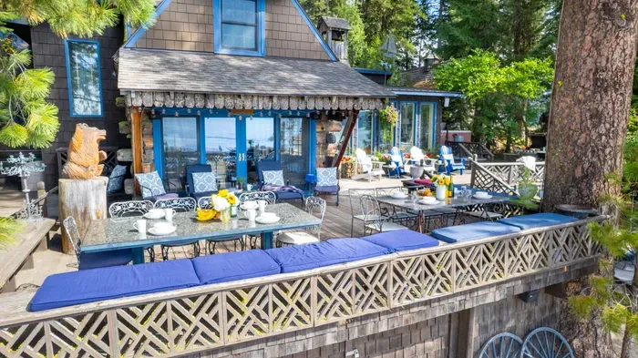 Two big granite dining tables on the deck mean everyone gets a seat with a view