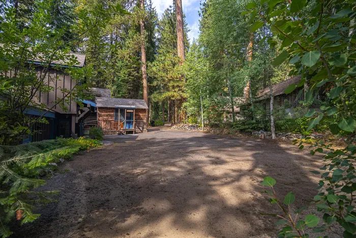 The Wigwam is a favorite for grandparents, couples, and early‑to‑bed types. The driveway is dirt, has enough room for a trailer, but turnaround space is limited