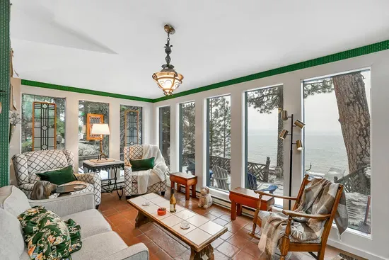 The sunroom: floor‑to‑ceiling lake views and the quietest mornings