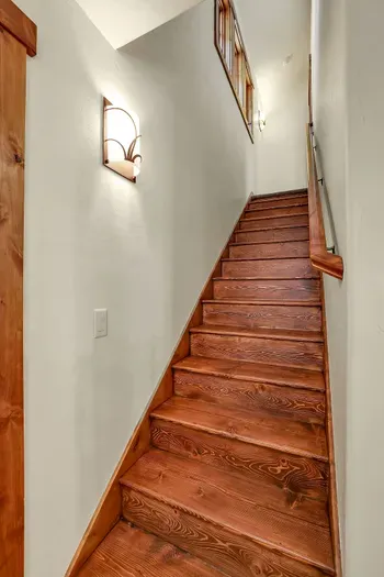 Upstairs, the second suite feels like its own little retreat—tucked away under the eaves with plenty of room to spread out