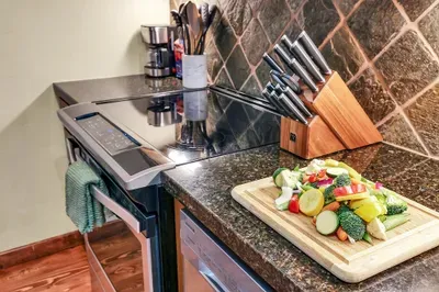 Whether it’s a hearty post‑ski pasta or simple sheet‑pan nachos, this cozy, functional kitchen makes staying in feel easy